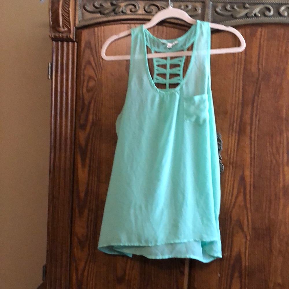 Sheer light green sleeveless blouse